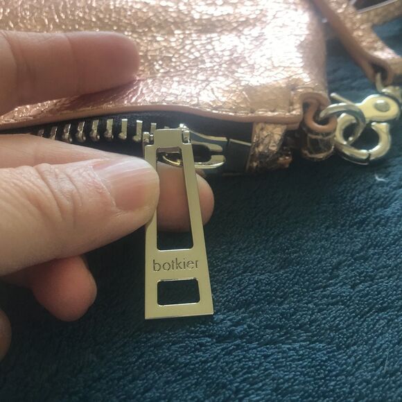 Botkier rose gold metallic trigger clutch crossbody with studs